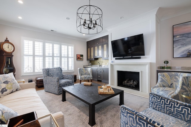 36 Southland Ave, Greenville, SC 29601 - living room featuring a chandelier, crown molding, recessed lighting, a fireplace, and bar area