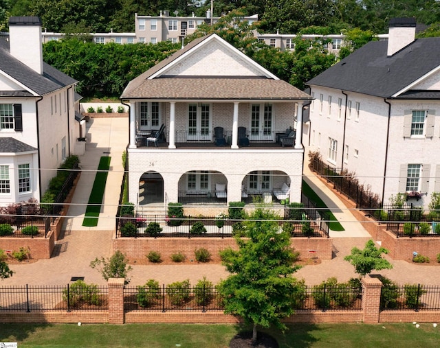 36 Southland Ave, Greenville, SC 29601 - view of front facade featuring a balcony and brick siding