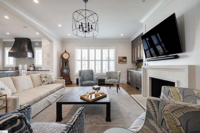 36 Southland Ave, Greenville, SC 29601 - living room with crown molding, a chandelier, light wood-style flooring, recessed lighting, and baseboards