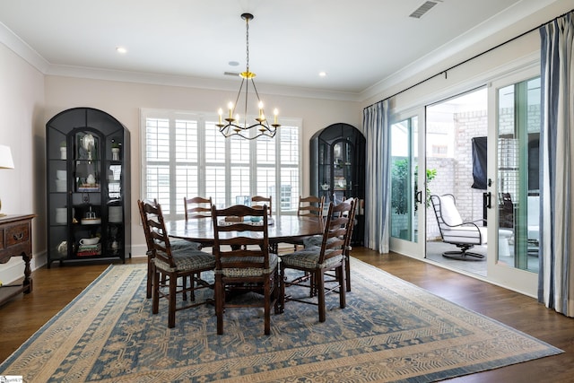 36 Southland Ave, Greenville, SC 29601 - dining area featuring a chandelier, ornamental molding, dark wood-style flooring, arched walkways, and recessed lighting