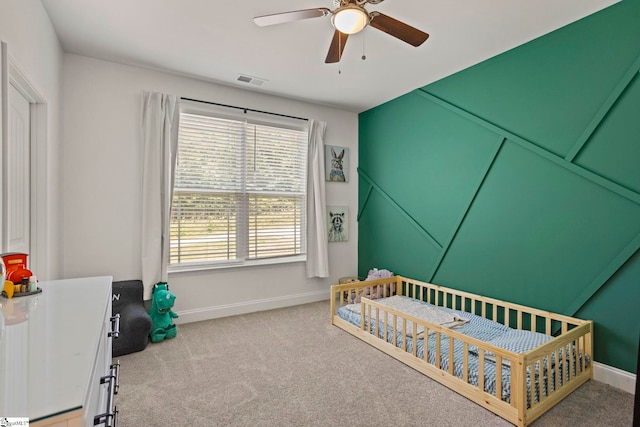 381 Butler Rd, Lyman, SC 29365 - bedroom with carpet, a nursery area, baseboards, and a ceiling fan