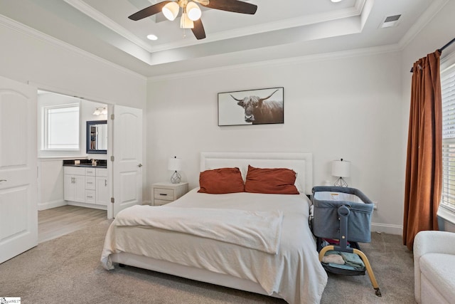 381 Butler Rd, Lyman, SC 29365 - bedroom with a tray ceiling, ornamental molding, light carpet, connected bathroom, and baseboards