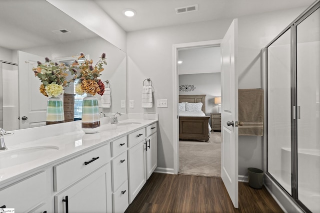 224 Anna Gray Cir, Easley, SC 29640 - ensuite bathroom featuring wood finished floors, double vanity, a stall shower, recessed lighting, and baseboards