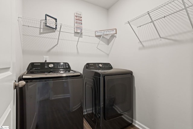 224 Anna Gray Cir, Easley, SC 29640 - laundry area featuring washing machine and clothes dryer, wood finished floors, and baseboards