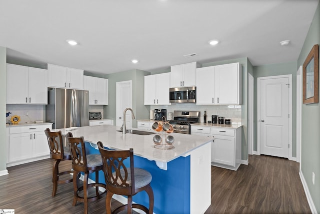 224 Anna Gray Cir, Easley, SC 29640 - kitchen featuring appliances with stainless steel finishes, a sink, backsplash, dark wood-type flooring, and recessed lighting