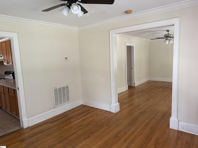 206 Rogers Ave, Greenville, SC 29617 - spare room featuring a ceiling fan, wood finished floors, ornamental molding, baseboards, and a smoke detector