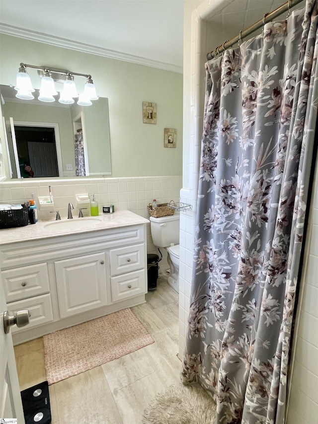 206 Caldwell St, Clinton, SC 29325 - bathroom featuring toilet, vanity, ornamental molding, tile walls, and a shower with curtain