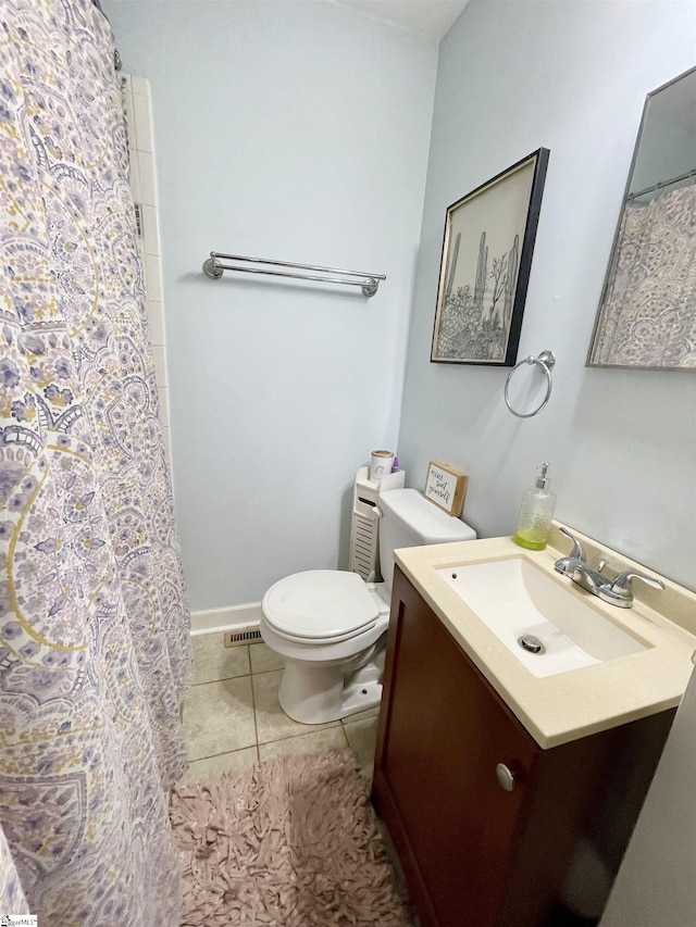 206 Caldwell St, Clinton, SC 29325 - bathroom with vanity, toilet, tile patterned flooring, and a shower with shower curtain