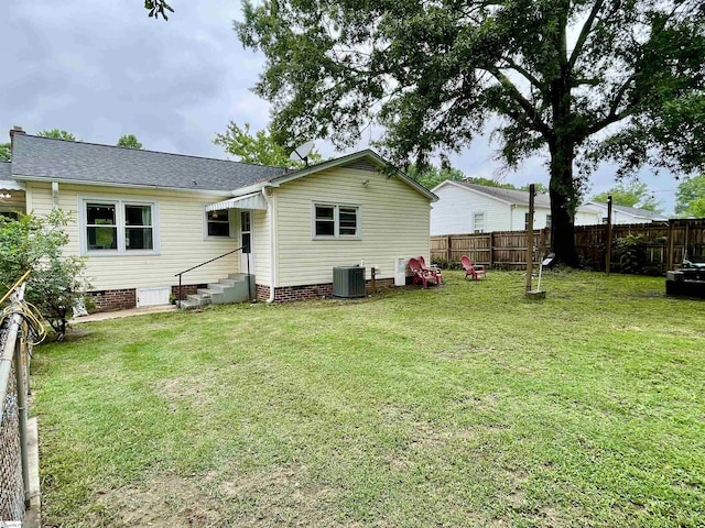206 Caldwell St, Clinton, SC 29325 - back of property featuring crawl space, entry steps, a shingled roof, and cooling unit