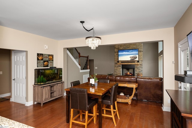 112 Woodstone Dr, Easley, SC 29642 - dining space featuring dark wood-style flooring, stairs, a chandelier, and baseboards