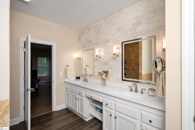 112 Woodstone Dr, Easley, SC 29642 - full bathroom featuring double vanity, wood finished floors, tile walls, backsplash, and baseboards