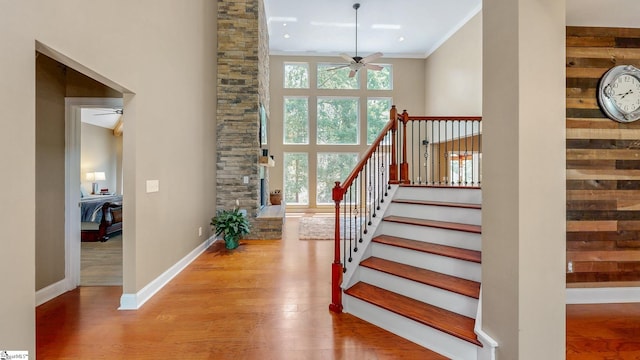 112 Woodstone Dr, Easley, SC 29642 - staircase with a ceiling fan, wood finished floors, baseboards, a towering ceiling, and ornamental molding
