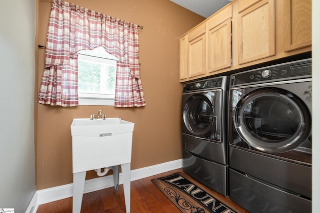 112 Woodstone Dr, Easley, SC 29642 - laundry area with separate washer and dryer, cabinet space, baseboards, and wood finished floors