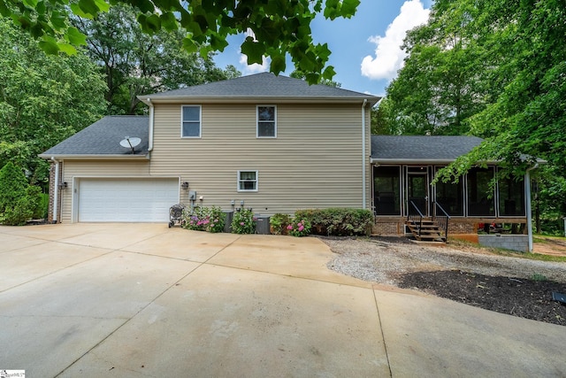 112 Woodstone Dr, Easley, SC 29642 - view of property exterior featuring a sunroom, concrete driveway, and a shingled roof