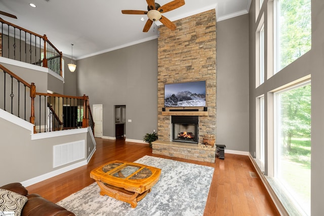 112 Woodstone Dr, Easley, SC 29642 - living area with ceiling fan, stairs, wood finished floors, baseboards, and a towering ceiling