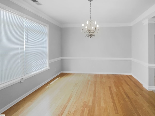 134 Lauren Wood Cir, Taylors, SC 29687 - unfurnished room featuring a chandelier, light wood-type flooring, baseboards, and crown molding