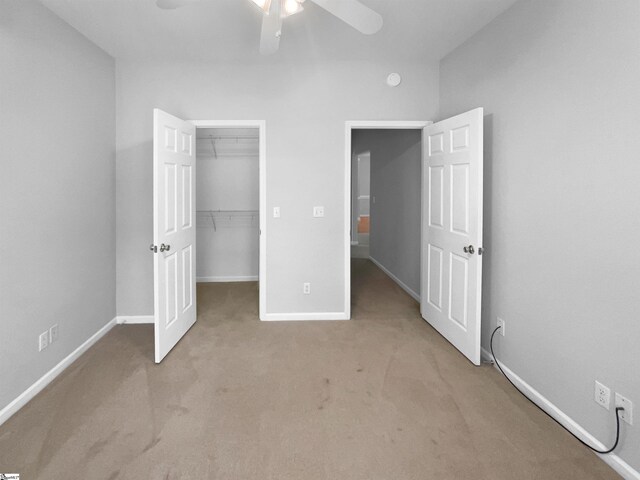 134 Lauren Wood Cir, Taylors, SC 29687 - unfurnished bedroom with carpet floors, a closet, a spacious closet, and ceiling fan