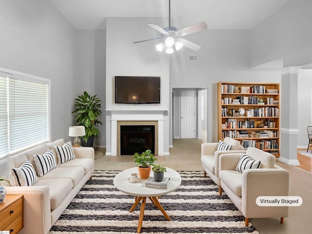 134 Lauren Wood Cir, Taylors, SC 29687 - living room featuring high vaulted ceiling, ceiling fan, a fireplace with flush hearth, and baseboards