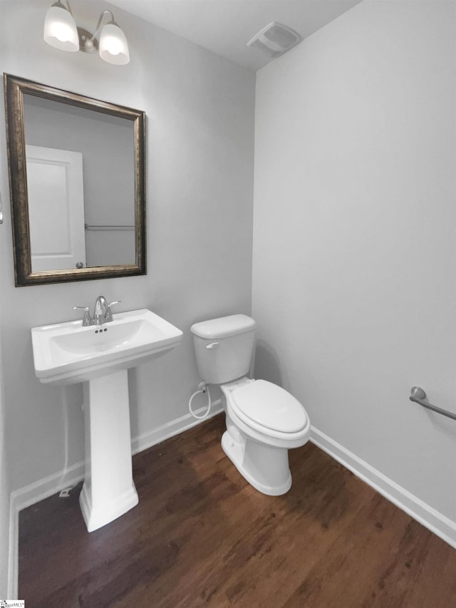 253 Golden Bear Walk, Duncan, SC 29334 - half bathroom with toilet, wood finished floors, and baseboards