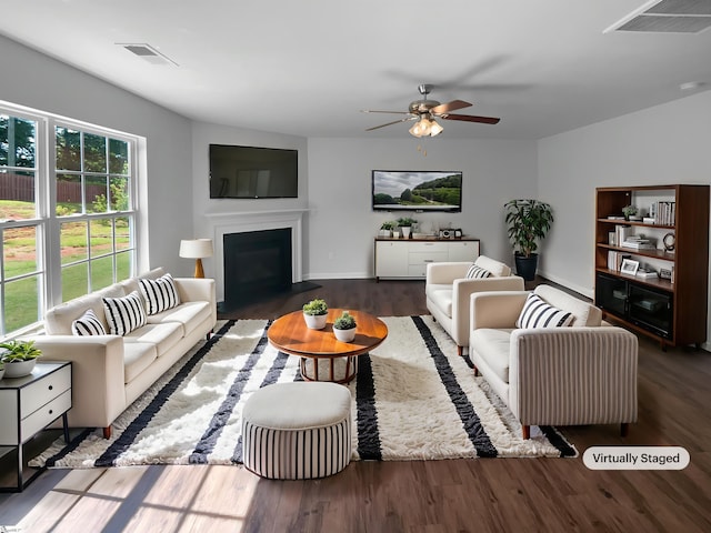 253 Golden Bear Walk, Duncan, SC 29334 - living room with ceiling fan, wood finished floors, a fireplace with flush hearth, and baseboards