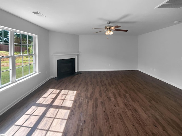 253 Golden Bear Walk, Duncan, SC 29334 - unfurnished living room featuring plenty of natural light, dark wood-style floors, a fireplace, and a ceiling fan