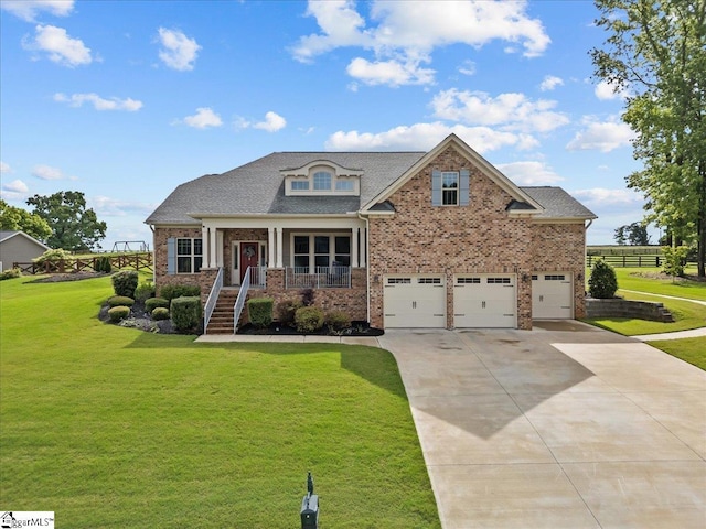 79 Modesto Ln, Simpsonville, SC 29681 - view of front of home featuring brick siding, driveway, a front yard, a porch, and an attached garage