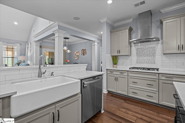 79 Modesto Ln, Simpsonville, SC 29681 - kitchen featuring stainless steel appliances, wall chimney exhaust hood, a sink, decorative columns, and backsplash