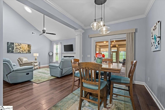 79 Modesto Ln, Simpsonville, SC 29681 - dining room featuring dark wood-style floors, baseboards, ornate columns, a fireplace, and ceiling fan