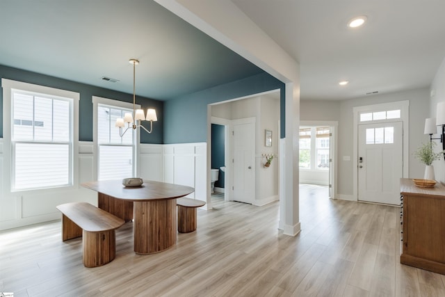 738 Judah Dr, Moore, SC 29369 - dining space with a chandelier, light wood finished floors, wainscoting, recessed lighting, and a decorative wall