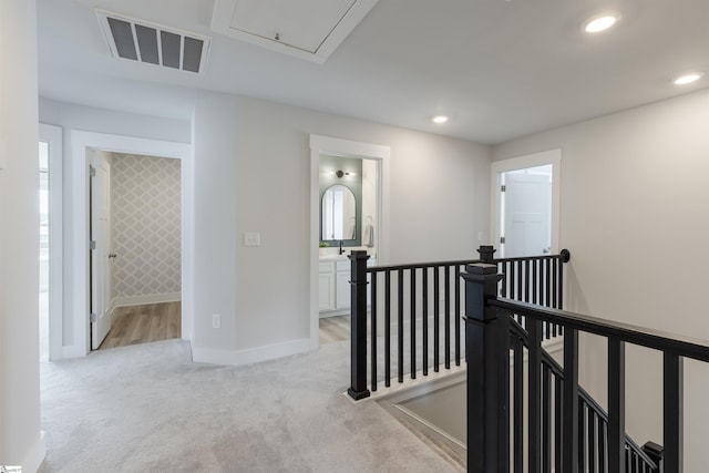738 Judah Dr, Moore, SC 29369 - hall with an upstairs landing, light carpet, baseboards, recessed lighting, and attic access