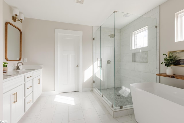 738 Judah Dr, Moore, SC 29369 - bathroom featuring a stall shower, a soaking tub, vanity, and marble look tiles