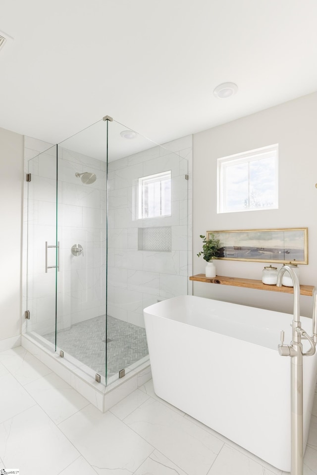 738 Judah Dr, Moore, SC 29369 - full bathroom featuring a freestanding tub, a stall shower, and marble finish floors