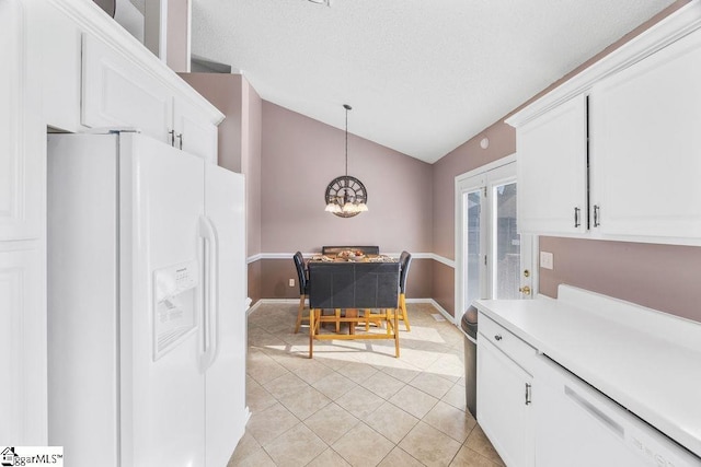 353 Old John Dodd Rd, Boiling Springs, SC 29316 - kitchen with white refrigerator with ice dispenser, lofted ceiling, light tile patterned floors, light countertops, and a textured ceiling