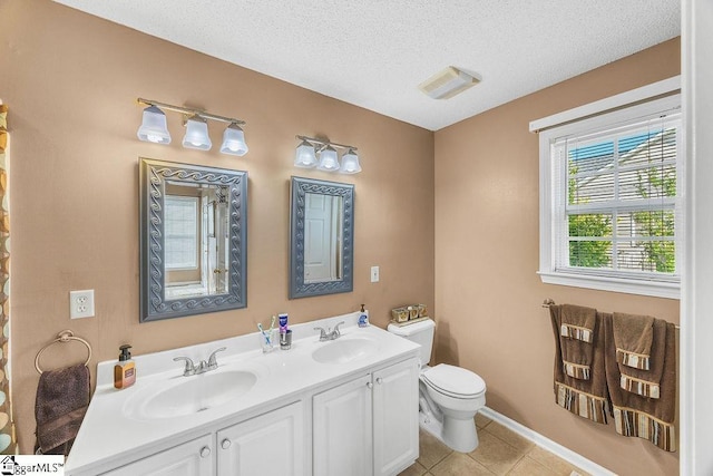 353 Old John Dodd Rd, Boiling Springs, SC 29316 - bathroom with tile patterned flooring, double vanity, and a textured ceiling