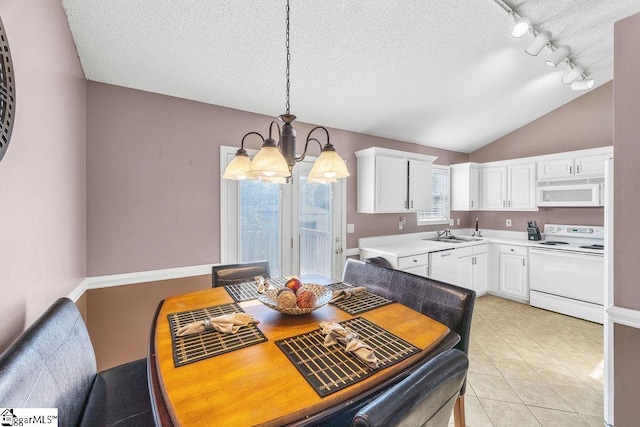 353 Old John Dodd Rd, Boiling Springs, SC 29316 - dining room with a chandelier, a textured ceiling, track lighting, lofted ceiling, and light tile patterned floors