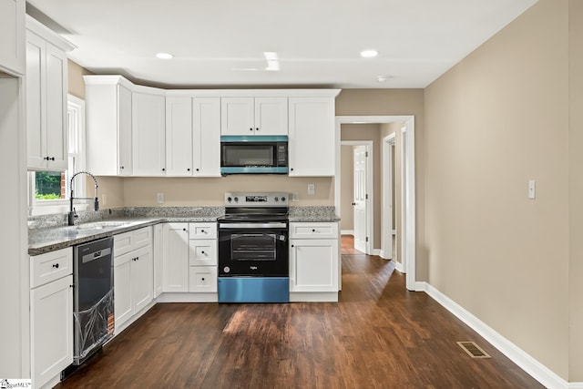 3401 Comanche St, Anderson, SC 29626 - kitchen with stainless steel appliances, stone countertops, dark wood-style flooring, white cabinetry, and recessed lighting