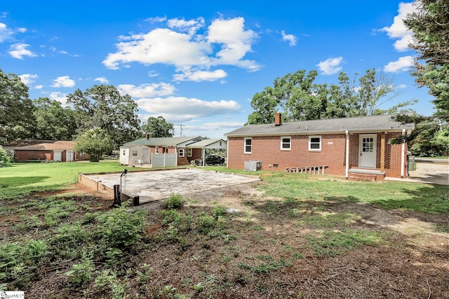 3401 Comanche St, Anderson, SC 29626 - rear view of property with a chimney, brick siding, and a yard