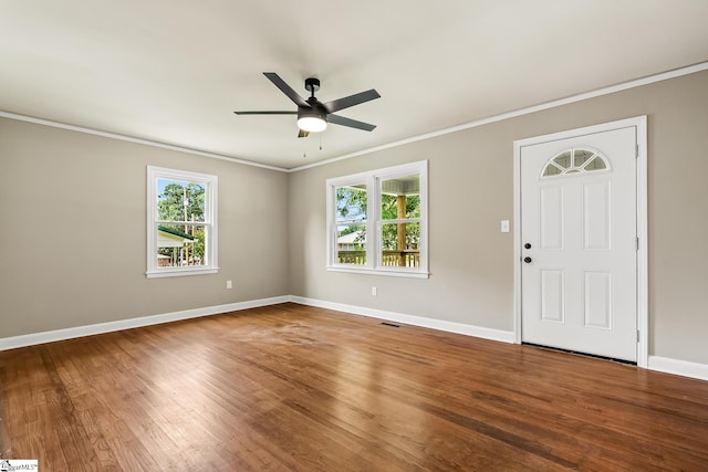 3401 Comanche St, Anderson, SC 29626 - empty room featuring ornamental molding, healthy amount of natural light, wood finished floors, and a ceiling fan