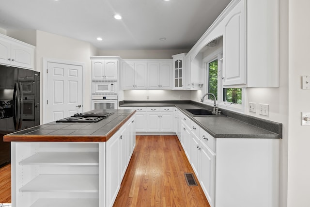 118 Pinnacle Pointe Dr, Seneca, SC 29672 - kitchen with open shelves, black appliances, white cabinetry, tile counters, and recessed lighting