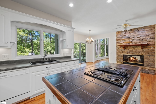 118 Pinnacle Pointe Dr, Seneca, SC 29672 - kitchen featuring white dishwasher, black electric cooktop, ceiling fan, white cabinets, and recessed lighting