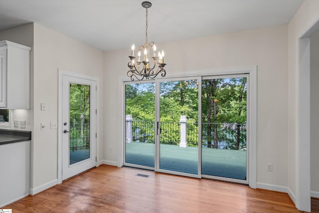 118 Pinnacle Pointe Dr, Seneca, SC 29672 - doorway to outside with wood finished floors and a chandelier