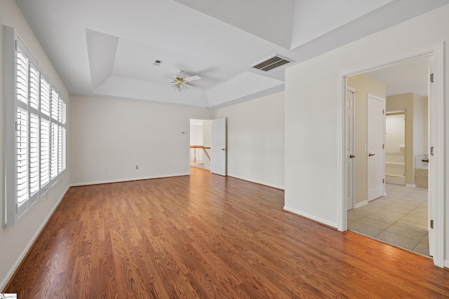 118 Pinnacle Pointe Dr, Seneca, SC 29672 - empty room featuring a ceiling fan, a tray ceiling, and wood finished floors