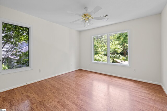 118 Pinnacle Pointe Dr, Seneca, SC 29672 - empty room with wood finished floors and a ceiling fan