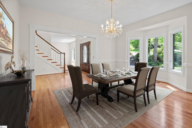 118 Pinnacle Pointe Dr, Seneca, SC 29672 - dining area with stairs, healthy amount of natural light, light wood-style flooring, and a chandelier