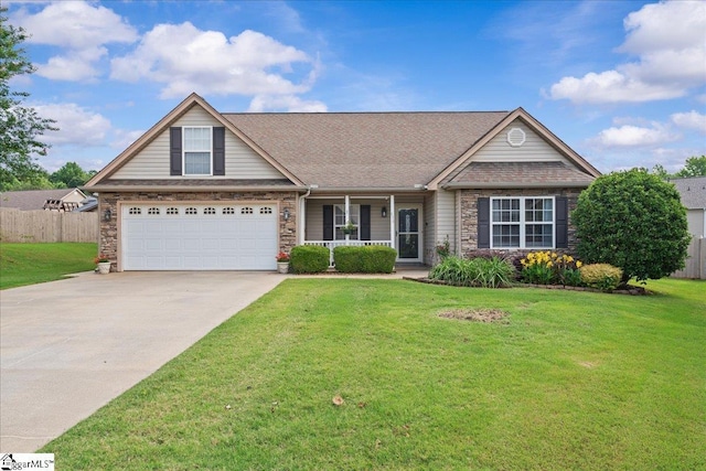 636 Cordelia Ct, Boiling Springs, SC 29316 - traditional home with stone siding, concrete driveway, covered porch, and an attached garage