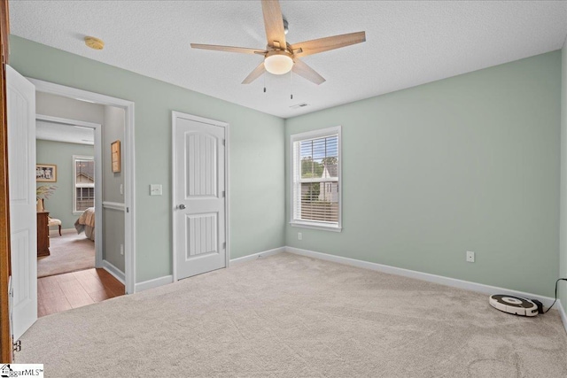 636 Cordelia Ct, Boiling Springs, SC 29316 - unfurnished bedroom featuring carpet, a textured ceiling, and a ceiling fan