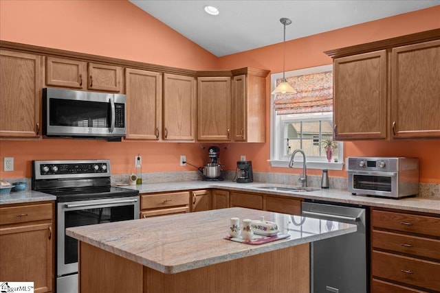 636 Cordelia Ct, Boiling Springs, SC 29316 - kitchen with stainless steel appliances, vaulted ceiling, pendant lighting, a center island, and light stone countertops
