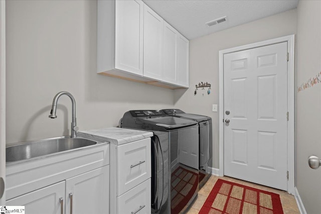 636 Cordelia Ct, Boiling Springs, SC 29316 - washroom with cabinet space, washer and dryer, and a textured ceiling