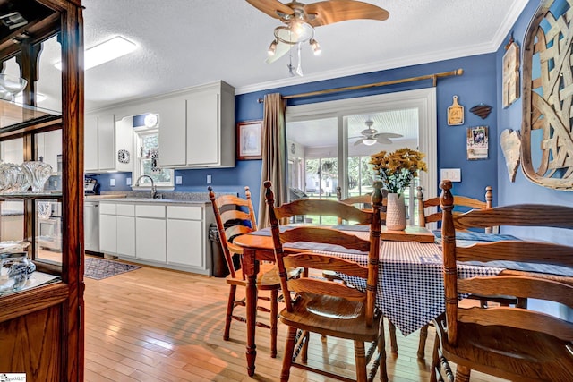 203 Ponder Rd, Greer, SC 29651 - dining area with ceiling fan, ornamental molding, a textured ceiling, light wood-style floors, and healthy amount of natural light