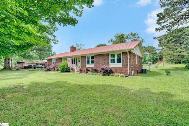 203 Ponder Rd, Greer, SC 29651 - single story home with brick siding, a chimney, a front yard, and a metal roof